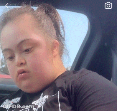 Woman With Down Syndrome Looking Out Car Window GIF