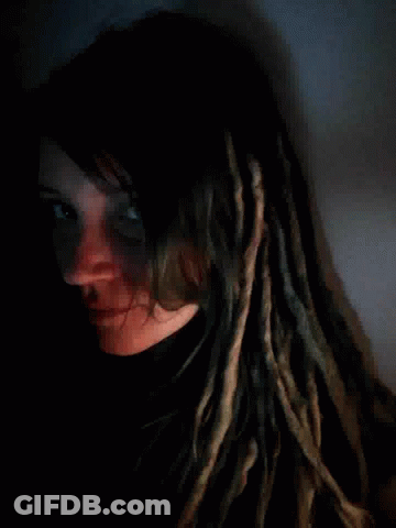 Woman With Dreadlocks Lying Down GIF