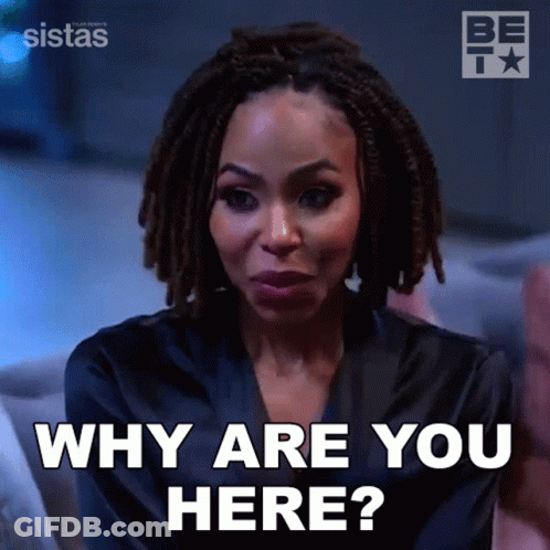 Woman With Dreadlocks Says Why Are You Here Sitting On Couch GIF