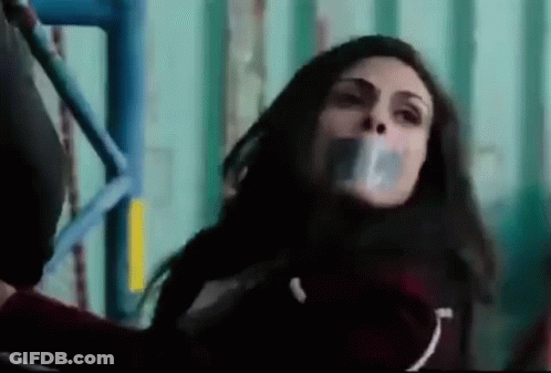 Woman With Duct Tape On Mouth On Scaffolding GIF