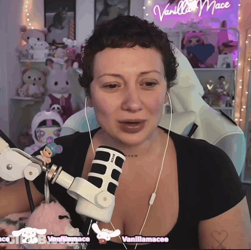 Woman With Ear Buds And Microphone Vanilla Mace GIF