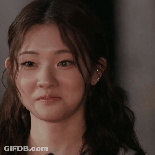 Woman With Ear Piercing Looking At Camera GIF