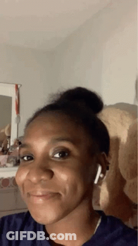 Woman With Earbuds And Teddy Bear GIF