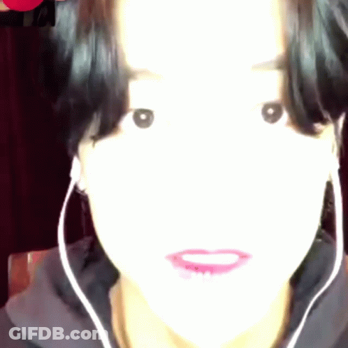 Woman With Earbuds Close Up GIF