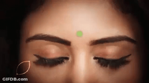Woman With Eyes Closed And Green Bindi GIF