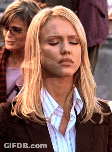 Woman With Eyes Closed And Striped Shirt GIF