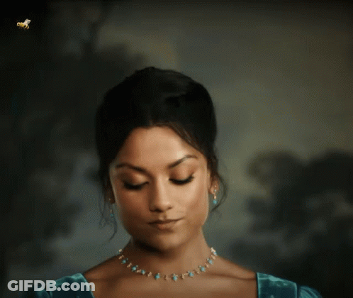 Woman With Eyes Closed And Turquoise Necklace And Earrings GIF