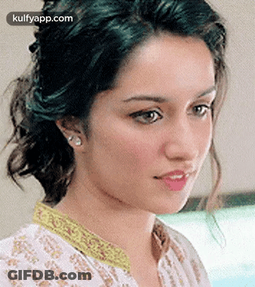 Woman With Eyes Closed And Yellow Collar GIF
