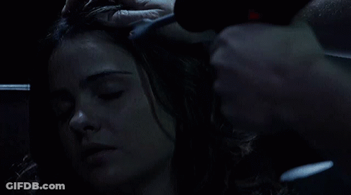 Woman With Eyes Closed Being Brushed GIF