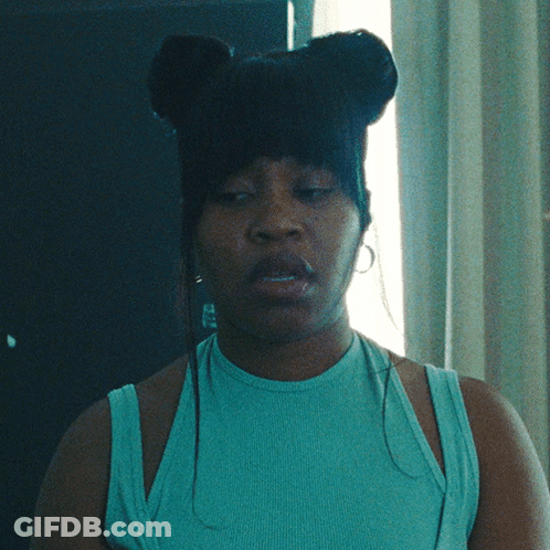 Woman With Eyes Closed In Blue Tank Top And Earrings GIF