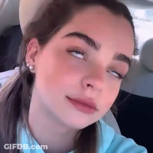Woman With Eyes Closed In Car GIF