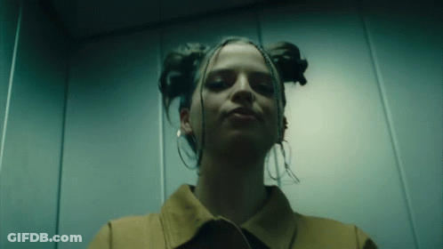 Woman With Eyes Closed In Elevator GIF