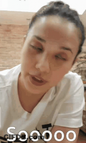 Woman With Eyes Closed In White Shirt Saying Soooo GIF