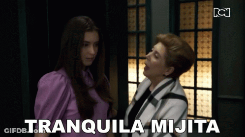 Woman With Eyes Closed Looking At Another Woman GIF