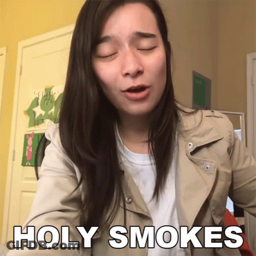 Woman With Eyes Closed Saying Holy Smoke GIF