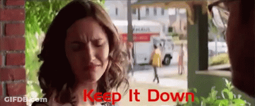 Woman With Eyes Closed Saying Keep It Down GIF