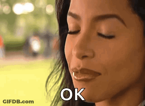 Woman With Eyes Closed Saying OK GIF