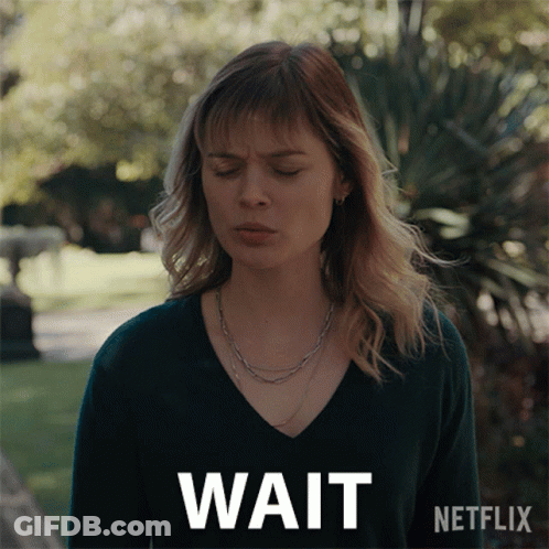 Woman With Eyes Closed Saying Wait GIF
