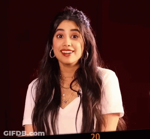 Woman With Eyes Closed Wearing Hoop Earrings And 20 Necklace GIF