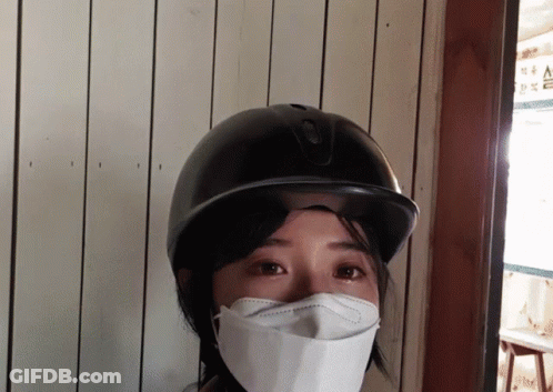 Woman With Face Mask And Helmet GIF