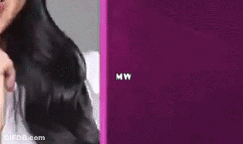 Woman With Face Shield Laughing Holding Microphone GIF