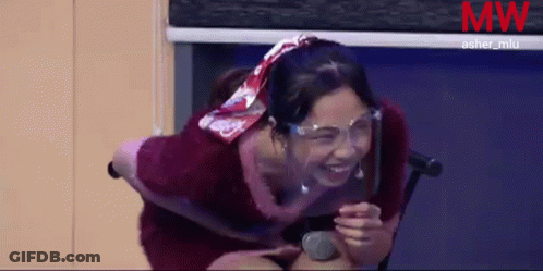 Woman With Face Shield Laughing Holding Microphone GIF