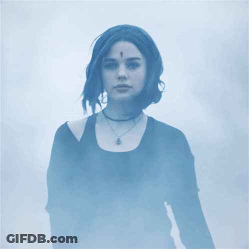 Woman With Feather On Forehead In Foggy Area GIF