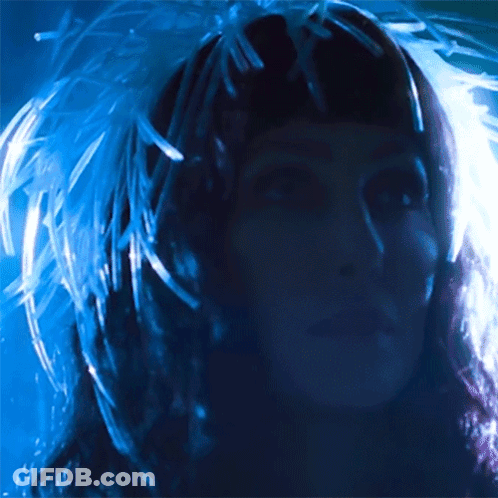 Woman With Feathers In Hair GIF