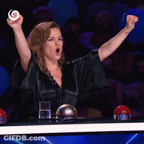 Woman With Fist In Air And Glass Of Water GIF