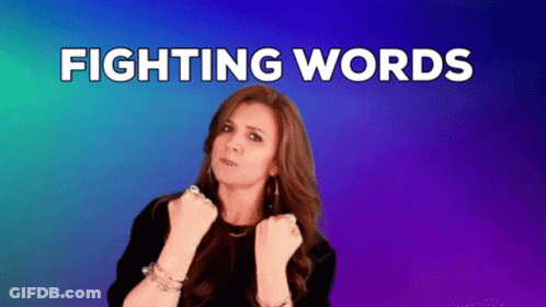 Woman With Fist In Air Saying Fighting Words GIF