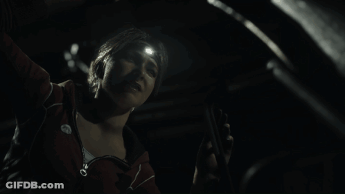 Woman With Flashlight On Head Looking Down GIF