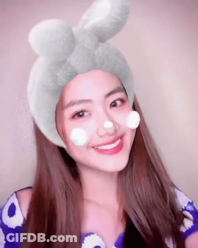Woman With Flower Crown Holding Red Apple GIF