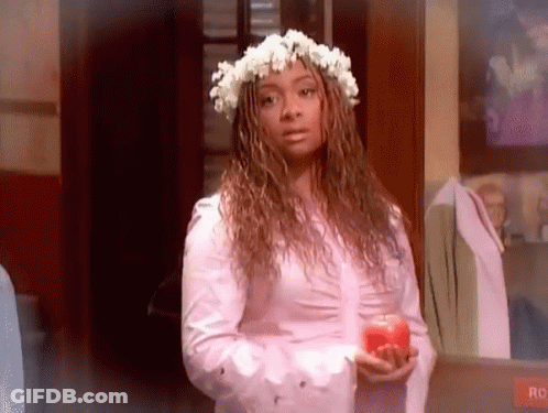 Woman With Flower Crown Holding Red Apple GIF