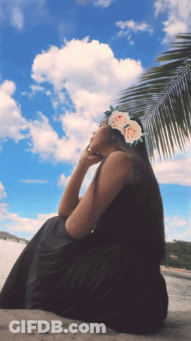 Woman With Flower Crown Sitting Beach GIF