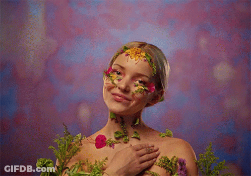 Woman With Flower Face Paint GIF