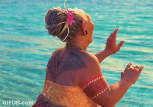 Woman With Flower In Hair And Tattoo On Back GIF