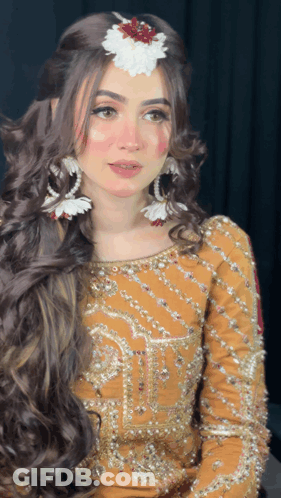 Woman With Flower In Hair And Yellow Dress GIF