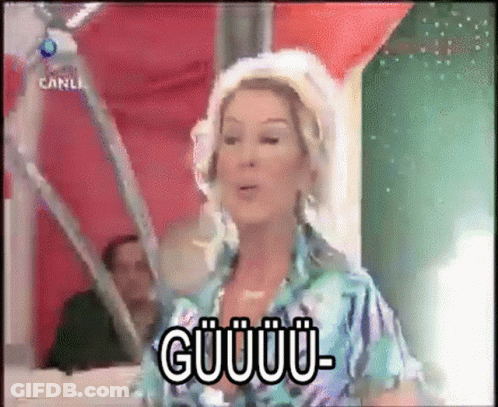 Woman With Flower In Hair Saying Guuu- GIF