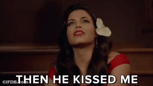 Woman With Flower In Hair Saying The World Exploded GIF