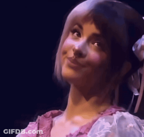 Woman With Flower In Hair Smiling GIF