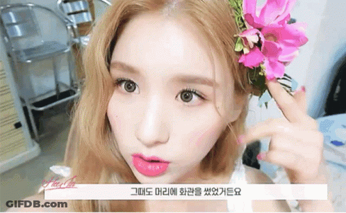 Woman With Flower In Hair GIF