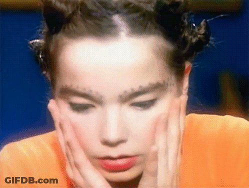 Woman With Forehead Tattoo And Red Shirt GIF