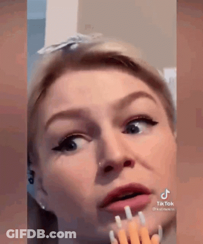 Woman With Fork In Mouth GIF
