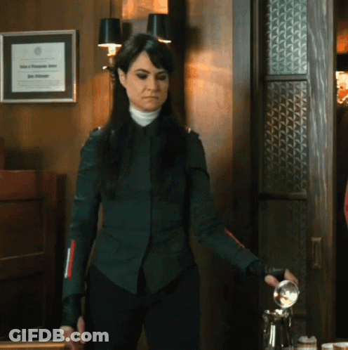 Woman With Framed Certificate Saying John A. Johnson GIF