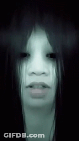 Woman With Ghostly Look In Dark GIF