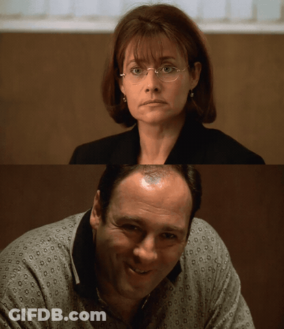 Woman With Glasses And Bald Man GIF