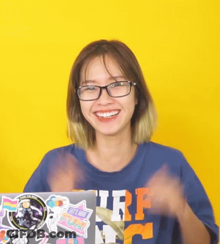Woman With Glasses And Blue Surf Shirt Smiling GIF