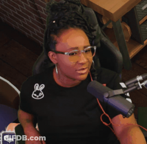 Woman With Glasses And Bunny Shirt At Microphone GIF