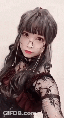 Woman With Glasses And Choker Taking Selfie GIF