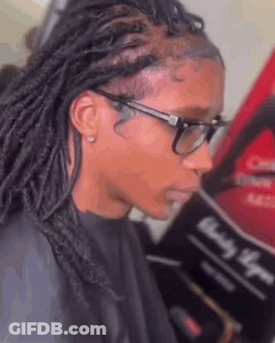Woman With Glasses And Dreadlocks Getting Hair Done At Salon GIF